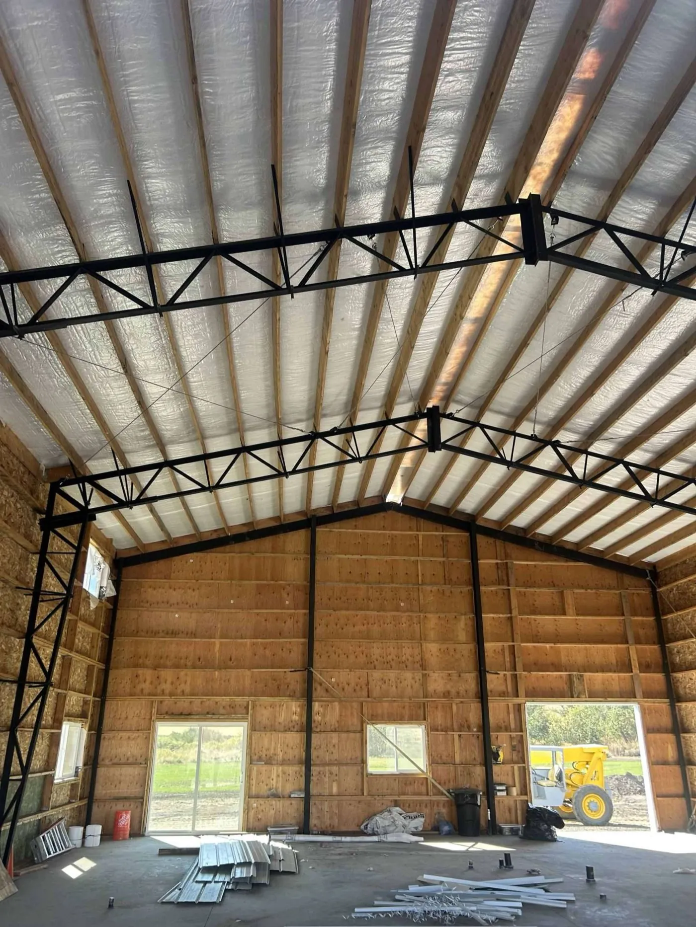 Steel truss bracing inside a large steel-frame building